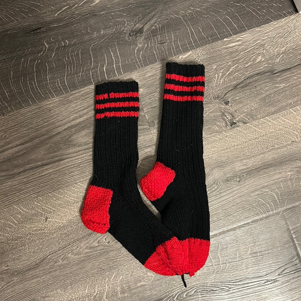 Men’s black and red hand knitted wool socks.